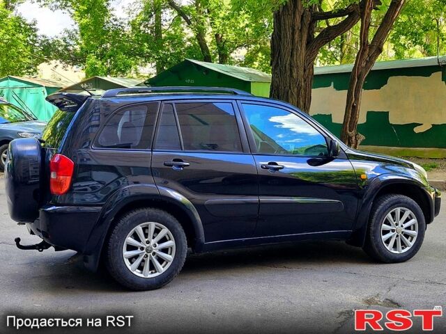 Черный Тойота РАВ 4, объемом двигателя 2 л и пробегом 300 тыс. км за 5700 $, фото 4 на Automoto.ua