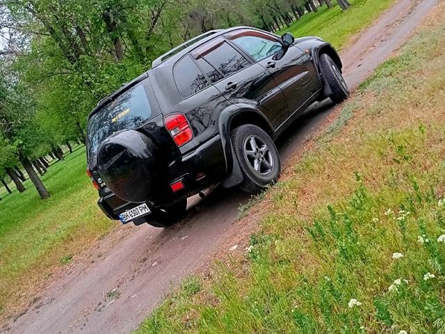 Чорний Тойота РАВ 4, об'ємом двигуна 2 л та пробігом 380 тис. км за 6500 $, фото 1 на Automoto.ua
