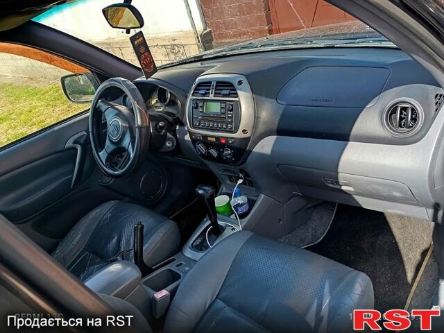 Чорний Тойота РАВ 4, об'ємом двигуна 2 л та пробігом 380 тис. км за 6500 $, фото 6 на Automoto.ua