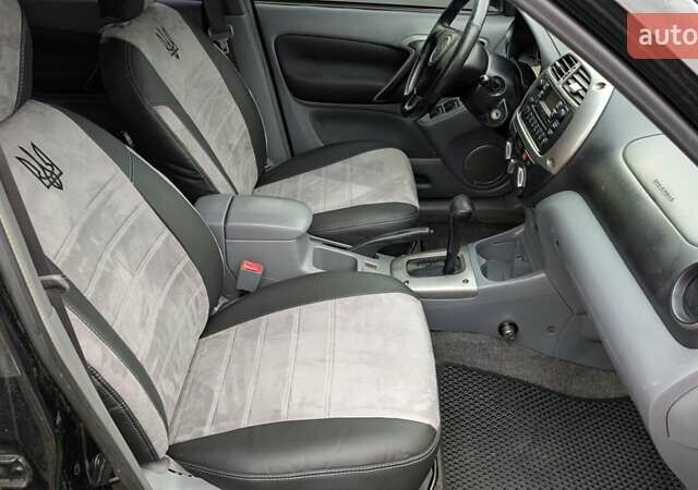 Черный Тойота РАВ 4, объемом двигателя 2 л и пробегом 406 тыс. км за 6000 $, фото 6 на Automoto.ua