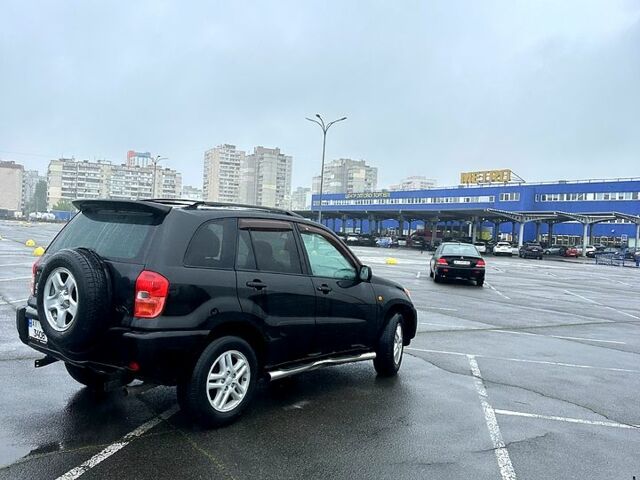 Черный Тойота РАВ 4, объемом двигателя 2 л и пробегом 225 тыс. км за 6350 $, фото 1 на Automoto.ua