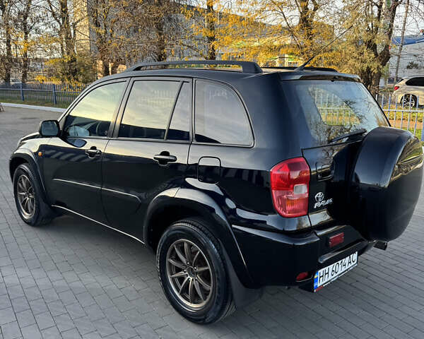 Черный Тойота РАВ 4, объемом двигателя 2 л и пробегом 479 тыс. км за 6000 $, фото 2 на Automoto.ua