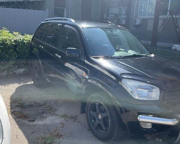 Черный Тойота РАВ 4, объемом двигателя 2 л и пробегом 360 тыс. км за 6000 $, фото 1 на Automoto.ua