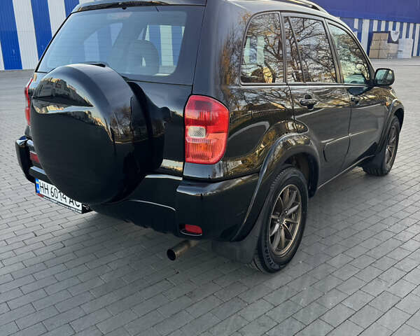 Черный Тойота РАВ 4, объемом двигателя 2 л и пробегом 479 тыс. км за 6000 $, фото 4 на Automoto.ua