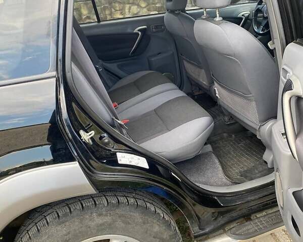 Чорний Тойота РАВ 4, об'ємом двигуна 2 л та пробігом 160 тис. км за 7000 $, фото 8 на Automoto.ua