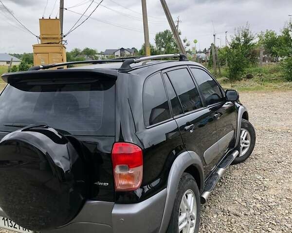 Чорний Тойота РАВ 4, об'ємом двигуна 2 л та пробігом 160 тис. км за 7000 $, фото 1 на Automoto.ua