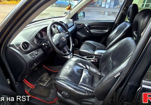 Черный Тойота РАВ 4, объемом двигателя 2 л и пробегом 224 тыс. км за 9000 $, фото 4 на Automoto.ua