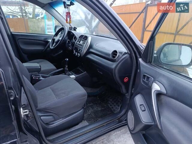 Черный Тойота РАВ 4, объемом двигателя 2 л и пробегом 253 тыс. км за 6000 $, фото 5 на Automoto.ua