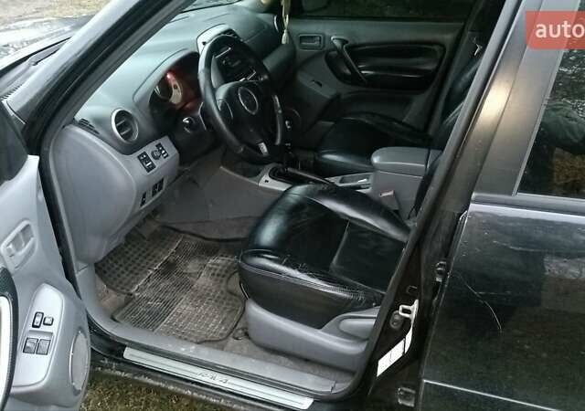 Черный Тойота РАВ 4, объемом двигателя 2 л и пробегом 312 тыс. км за 4300 $, фото 3 на Automoto.ua