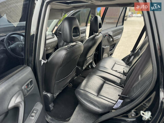 Черный Тойота РАВ 4, объемом двигателя 2 л и пробегом 230 тыс. км за 7850 $, фото 26 на Automoto.ua