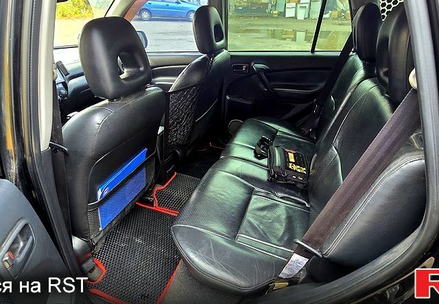 Черный Тойота РАВ 4, объемом двигателя 2 л и пробегом 224 тыс. км за 9000 $, фото 5 на Automoto.ua