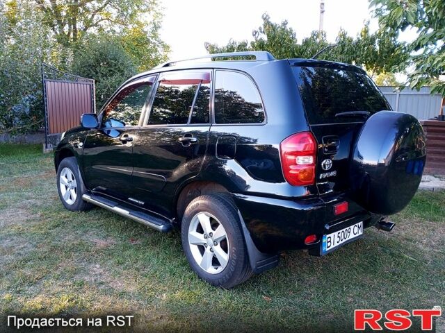 Чорний Тойота РАВ 4, об'ємом двигуна 2 л та пробігом 251 тис. км за 7100 $, фото 1 на Automoto.ua
