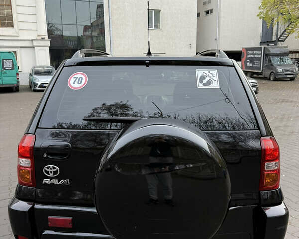 Черный Тойота РАВ 4, объемом двигателя 2 л и пробегом 230 тыс. км за 6500 $, фото 3 на Automoto.ua