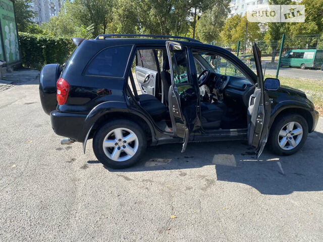 Черный Тойота РАВ 4, объемом двигателя 2 л и пробегом 262 тыс. км за 8800 $, фото 4 на Automoto.ua