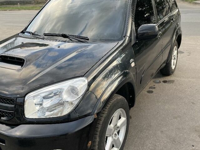 Черный Тойота РАВ 4, объемом двигателя 2 л и пробегом 250 тыс. км за 4800 $, фото 1 на Automoto.ua
