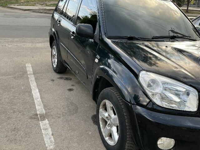 Черный Тойота РАВ 4, объемом двигателя 2 л и пробегом 250 тыс. км за 4800 $, фото 5 на Automoto.ua