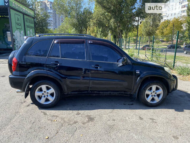 Черный Тойота РАВ 4, объемом двигателя 2 л и пробегом 262 тыс. км за 8800 $, фото 2 на Automoto.ua