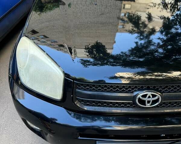 Черный Тойота РАВ 4, объемом двигателя 2 л и пробегом 279 тыс. км за 7000 $, фото 1 на Automoto.ua