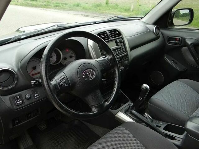 Черный Тойота РАВ 4, объемом двигателя 2 л и пробегом 210 тыс. км за 2600 $, фото 6 на Automoto.ua