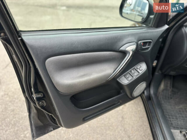 Черный Тойота РАВ 4, объемом двигателя 2 л и пробегом 243 тыс. км за 6900 $, фото 7 на Automoto.ua