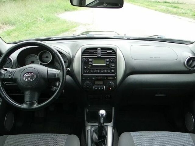 Черный Тойота РАВ 4, объемом двигателя 2 л и пробегом 210 тыс. км за 2600 $, фото 4 на Automoto.ua