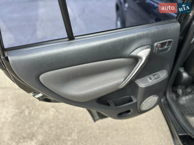 Черный Тойота РАВ 4, объемом двигателя 2 л и пробегом 243 тыс. км за 6900 $, фото 10 на Automoto.ua