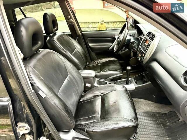 Черный Тойота РАВ 4, объемом двигателя 2 л и пробегом 199 тыс. км за 6999 $, фото 58 на Automoto.ua