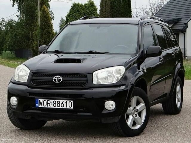 Черный Тойота РАВ 4, объемом двигателя 2 л и пробегом 210 тыс. км за 2600 $, фото 1 на Automoto.ua