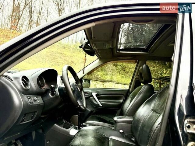 Черный Тойота РАВ 4, объемом двигателя 2 л и пробегом 199 тыс. км за 6999 $, фото 47 на Automoto.ua