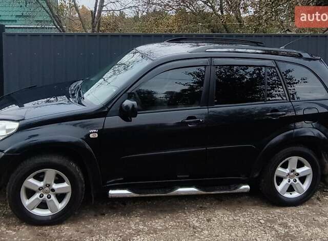 Черный Тойота РАВ 4, объемом двигателя 2 л и пробегом 186 тыс. км за 9500 $, фото 1 на Automoto.ua