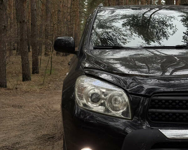 Чорний Тойота РАВ 4, об'ємом двигуна 2 л та пробігом 189 тис. км за 9500 $, фото 4 на Automoto.ua