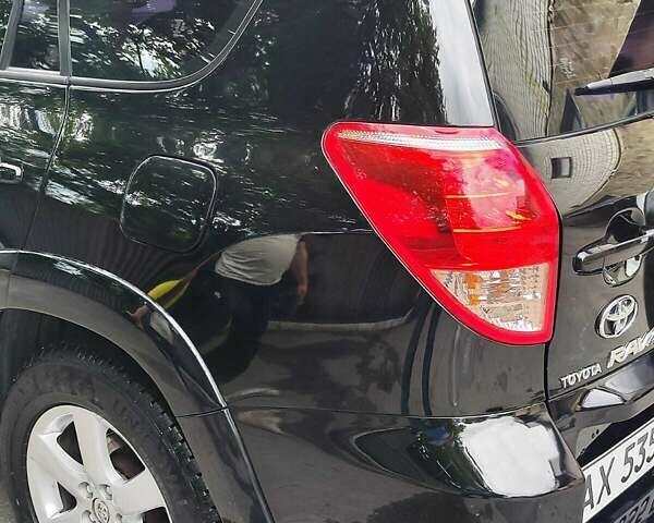 Чорний Тойота РАВ 4, об'ємом двигуна 2.4 л та пробігом 91 тис. км за 12500 $, фото 13 на Automoto.ua