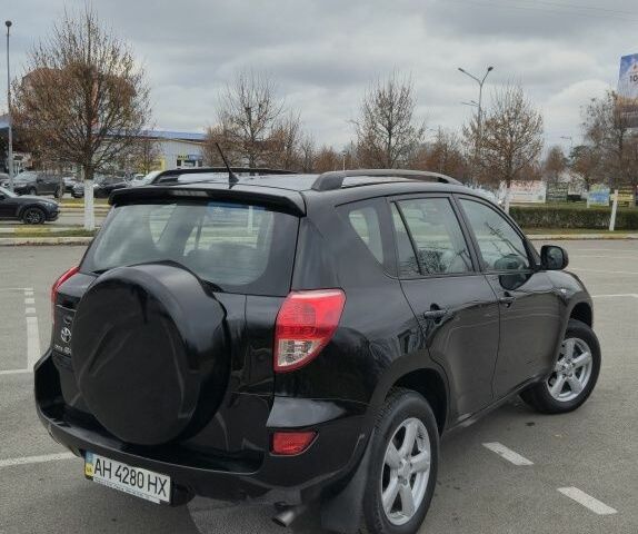 Черный Тойота РАВ 4, объемом двигателя 2 л и пробегом 173 тыс. км за 8999 $, фото 1 на Automoto.ua