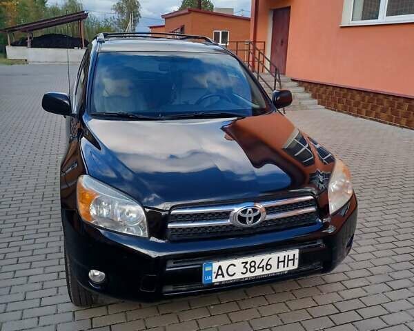 Черный Тойота РАВ 4, объемом двигателя 2.36 л и пробегом 200 тыс. км за 9000 $, фото 1 на Automoto.ua