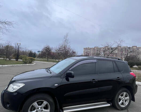 Черный Тойота РАВ 4, объемом двигателя 2 л и пробегом 248 тыс. км за 8700 $, фото 2 на Automoto.ua