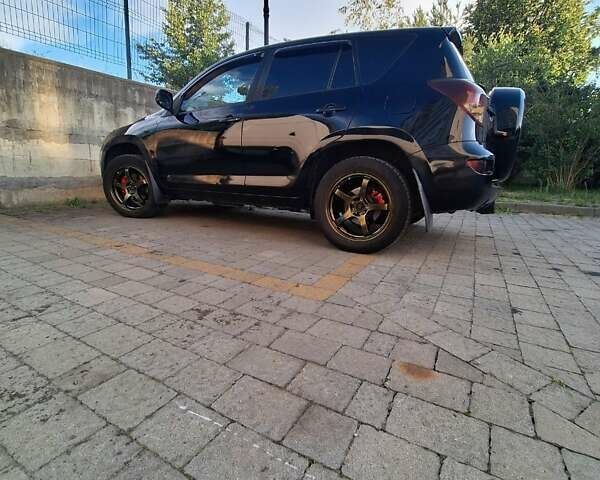 Черный Тойота РАВ 4, объемом двигателя 2 л и пробегом 264 тыс. км за 9200 $, фото 3 на Automoto.ua