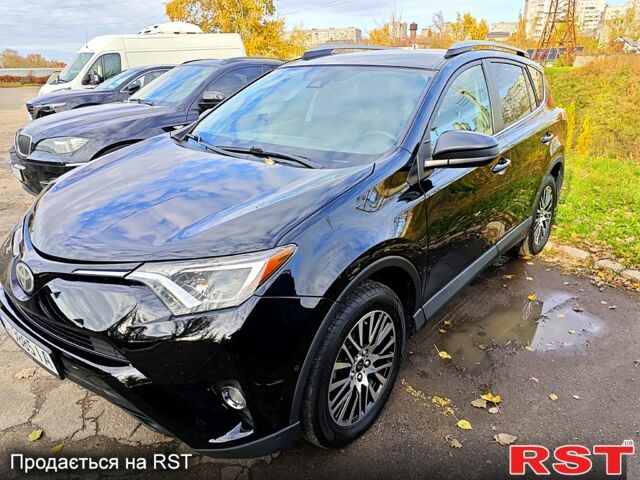 Черный Тойота РАВ 4, объемом двигателя 2.5 л и пробегом 128 тыс. км за 23000 $, фото 2 на Automoto.ua