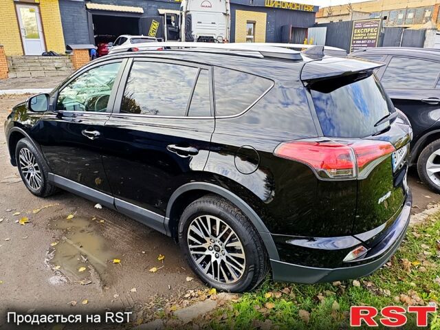 Черный Тойота РАВ 4, объемом двигателя 2.5 л и пробегом 128 тыс. км за 23000 $, фото 1 на Automoto.ua