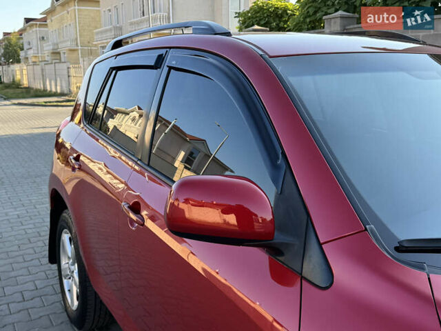 Червоний Тойота РАВ 4, об'ємом двигуна 2 л та пробігом 180 тис. км за 8999 $, фото 5 на Automoto.ua