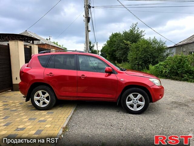 Червоний Тойота РАВ 4, об'ємом двигуна 2 л та пробігом 200 тис. км за 7500 $, фото 6 на Automoto.ua