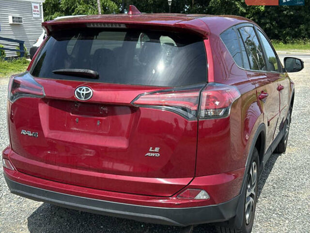 Червоний Тойота РАВ 4, об'ємом двигуна 2.49 л та пробігом 225 тис. км за 9600 $, фото 2 на Automoto.ua