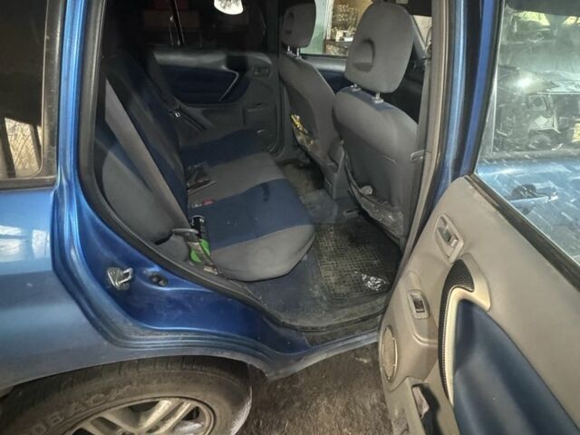 Синий Тойота РАВ 4, объемом двигателя 2 л и пробегом 250 тыс. км за 1800 $, фото 1 на Automoto.ua