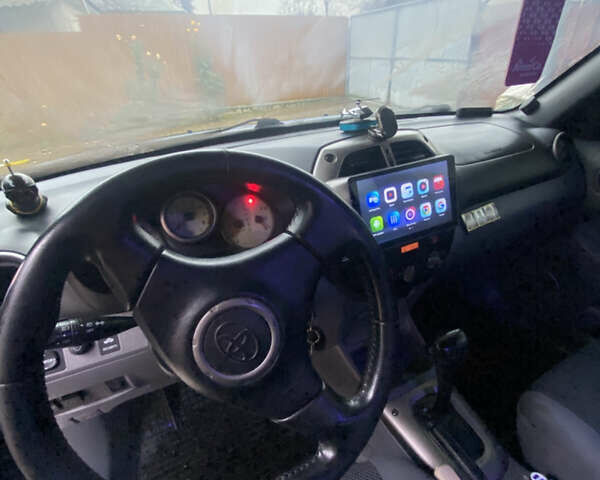 Синій Тойота РАВ 4, об'ємом двигуна 2 л та пробігом 244 тис. км за 6800 $, фото 24 на Automoto.ua