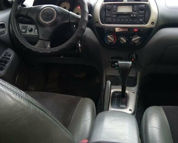 Синий Тойота РАВ 4, объемом двигателя 2 л и пробегом 226 тыс. км за 7800 $, фото 5 на Automoto.ua