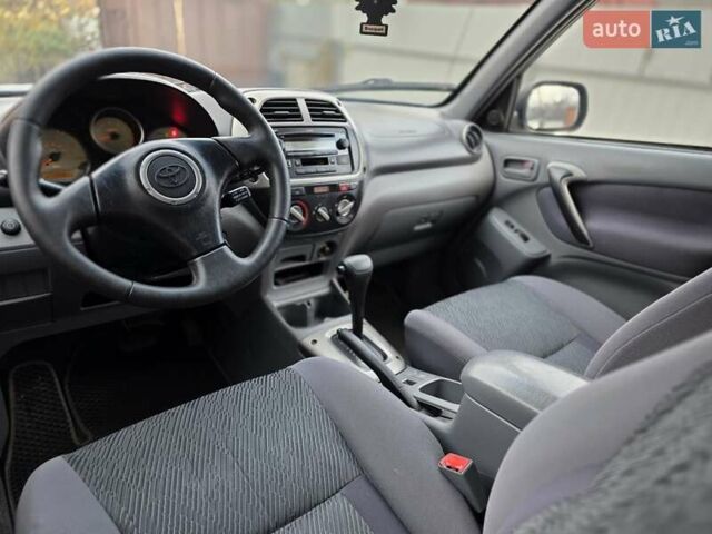 Синий Тойота РАВ 4, объемом двигателя 2 л и пробегом 134 тыс. км за 5900 $, фото 30 на Automoto.ua