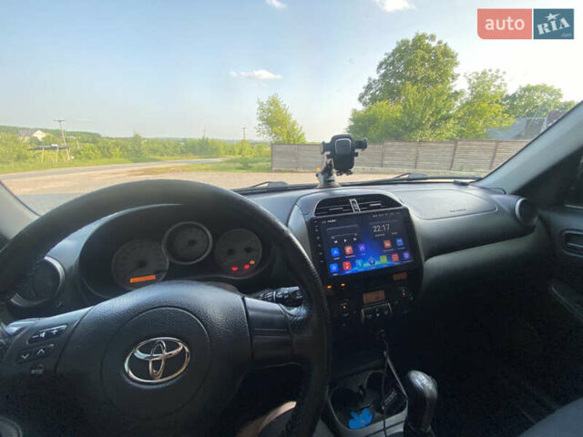 Синій Тойота РАВ 4, об'ємом двигуна 2 л та пробігом 235 тис. км за 6900 $, фото 22 на Automoto.ua