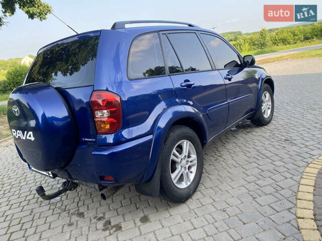 Синій Тойота РАВ 4, об'ємом двигуна 2 л та пробігом 235 тис. км за 6900 $, фото 4 на Automoto.ua