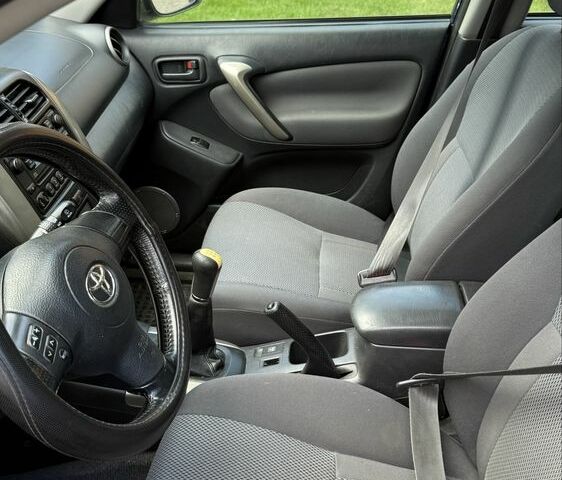 Синий Тойота РАВ 4, объемом двигателя 2 л и пробегом 332 тыс. км за 4000 $, фото 5 на Automoto.ua