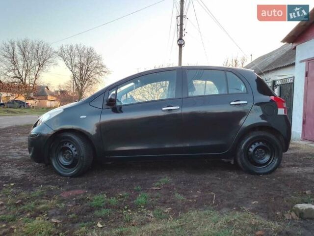 Черный Тойота Ярис, объемом двигателя 1.33 л и пробегом 162 тыс. км за 6500 $, фото 6 на Automoto.ua