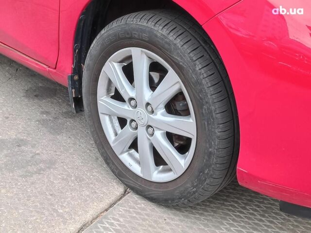 Червоний Тойота Яріс, об'ємом двигуна 1.3 л та пробігом 88 тис. км за 10440 $, фото 4 на Automoto.ua